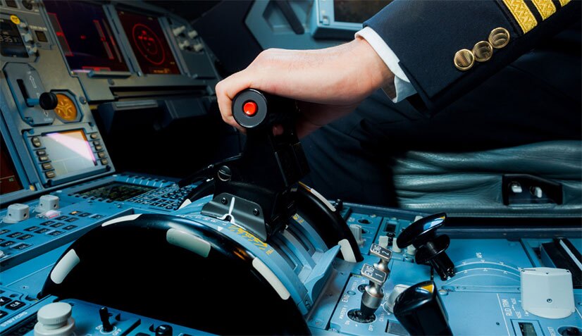 Close-up of a pilot operating the throttle in a cockpit, symbolizing precision and control, much like an autopilot investment strategy or a pilot 401k plan designed to secure retirement through an effective program.